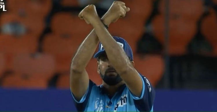 An umpire signals for an Impact Player substitution during the IPL