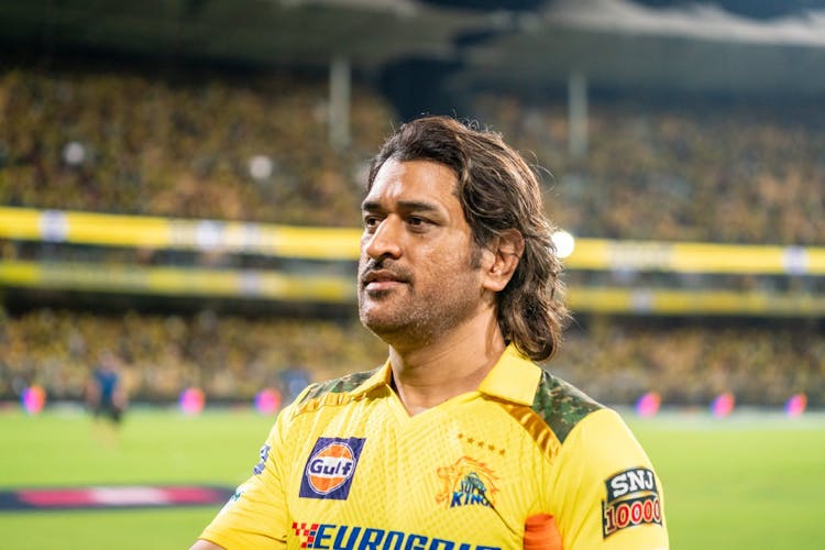 MS Dhoni in a cricket match wearing the Chennai Super Kings jersey
