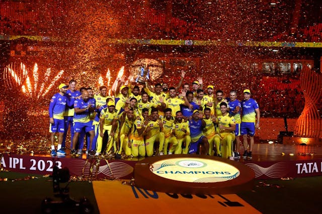 Players of Chennai Super Kings celebrate with the trophy after their victory against the Gujarat Titans in the Indian Premier League (IPL) Twenty20