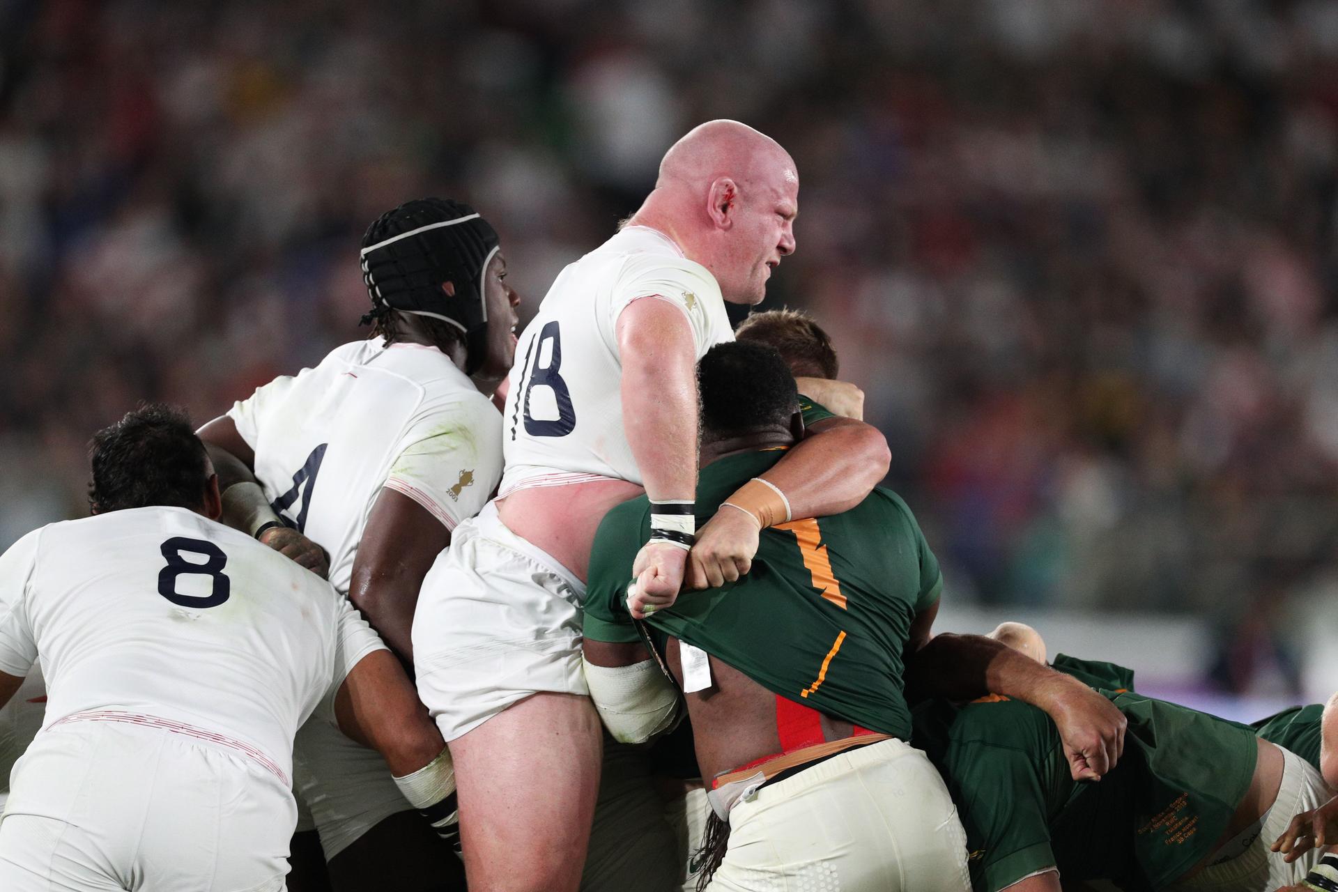 Dan Cole of England is driven up in the scrum by Tendai Mtawarira 