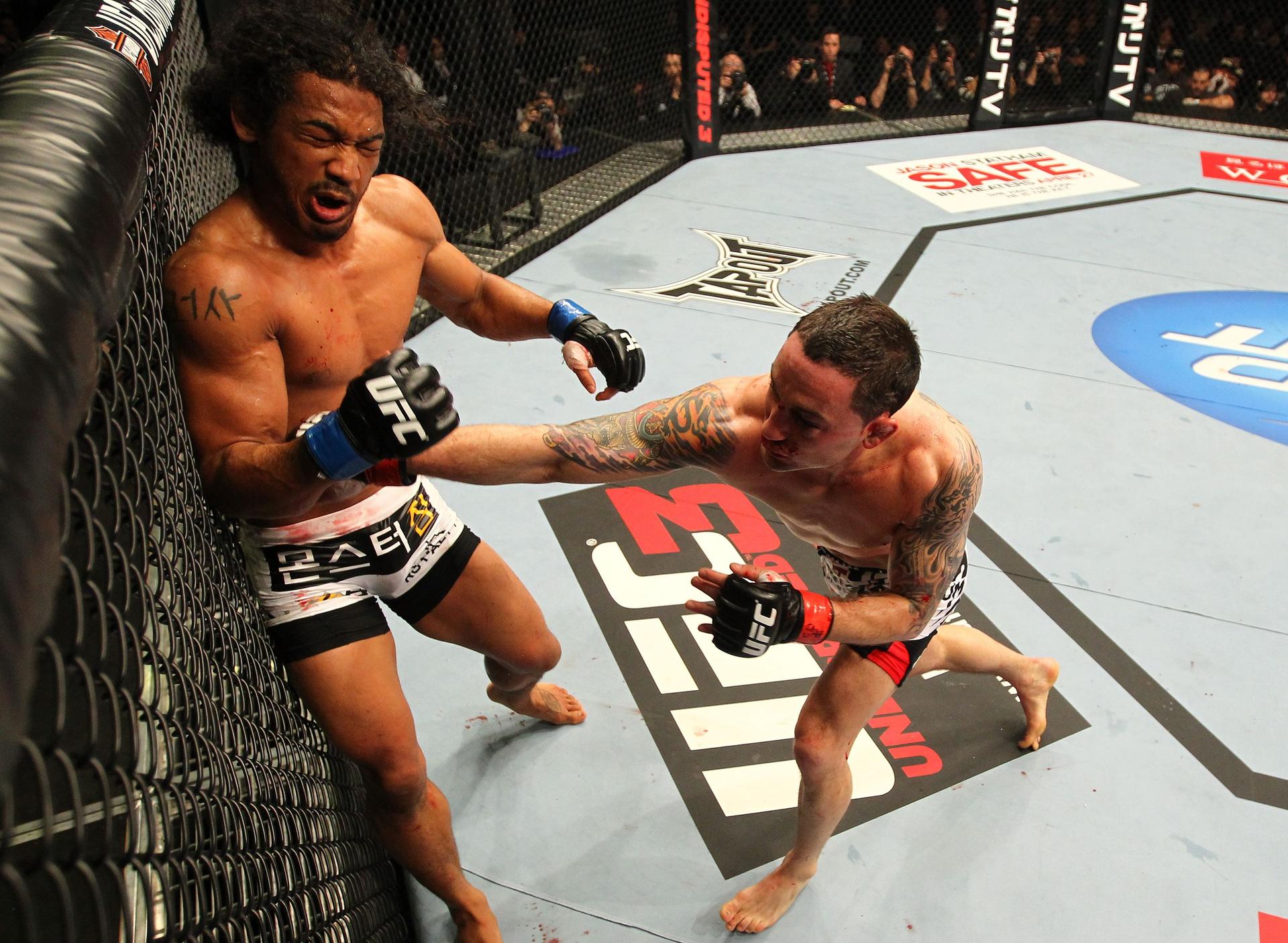 Frankie Edgar punches Benson Henderson