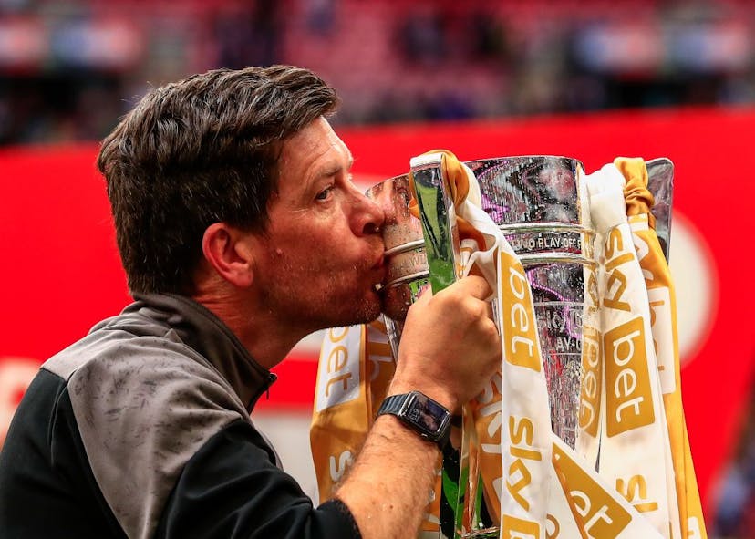Port Vale manager Darrell Clarke kisses the EFL Division 2 Trophy during the Sky Bet League