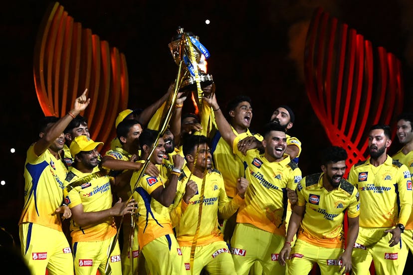 Chennai Super Kings' players celebrate with the trophy after their victory against Gujarat Titans in the Indian Premier League 