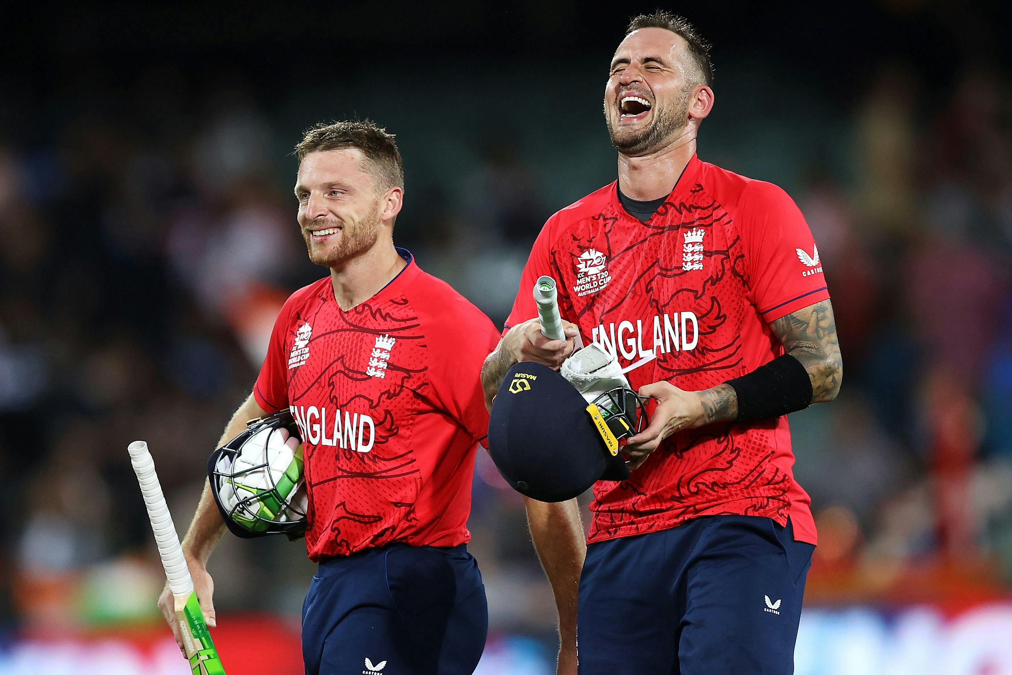 s Buttler and Alex Hales of England share a laugh as they celebrate victory during the ICC Men's T20 World Cup Semi Final match between India and England 