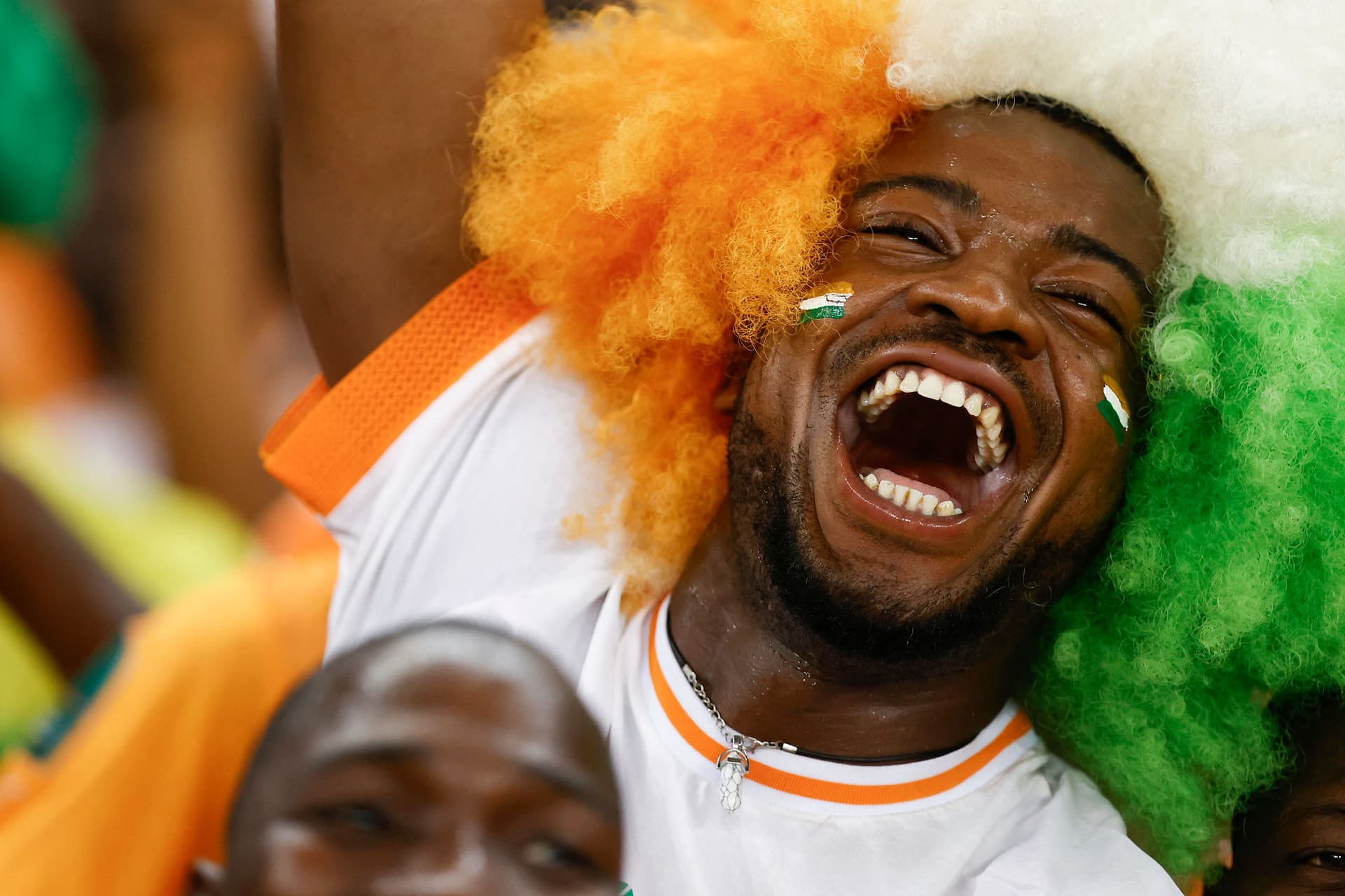 An Ivory Coast supporter gestures after Ivory Coast won the Africa Cup of Nations