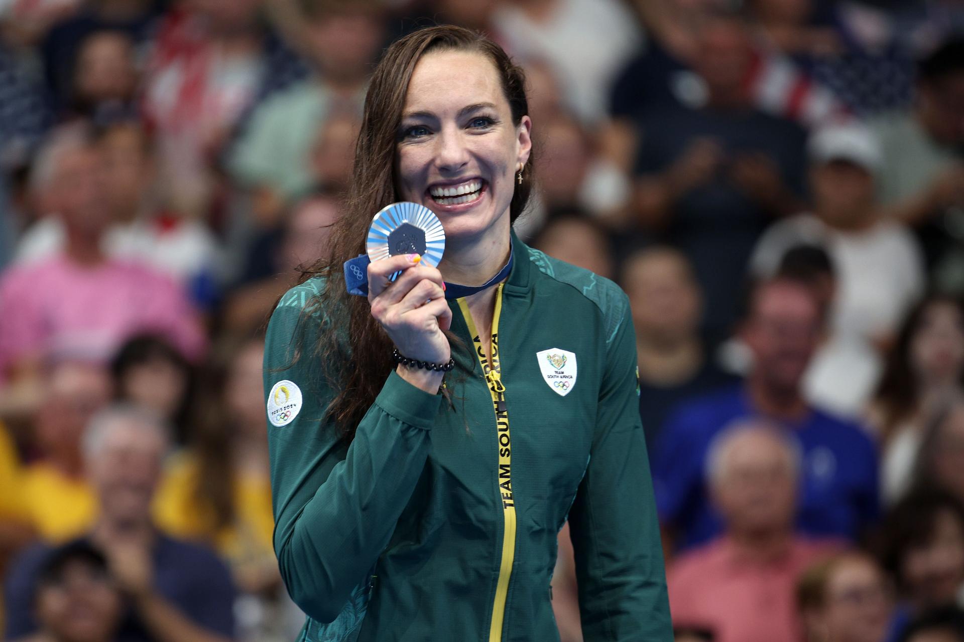 Silver Medalist Tatjana Smith of Team South Africa poses on the podium during the Swimming medal ceremony 