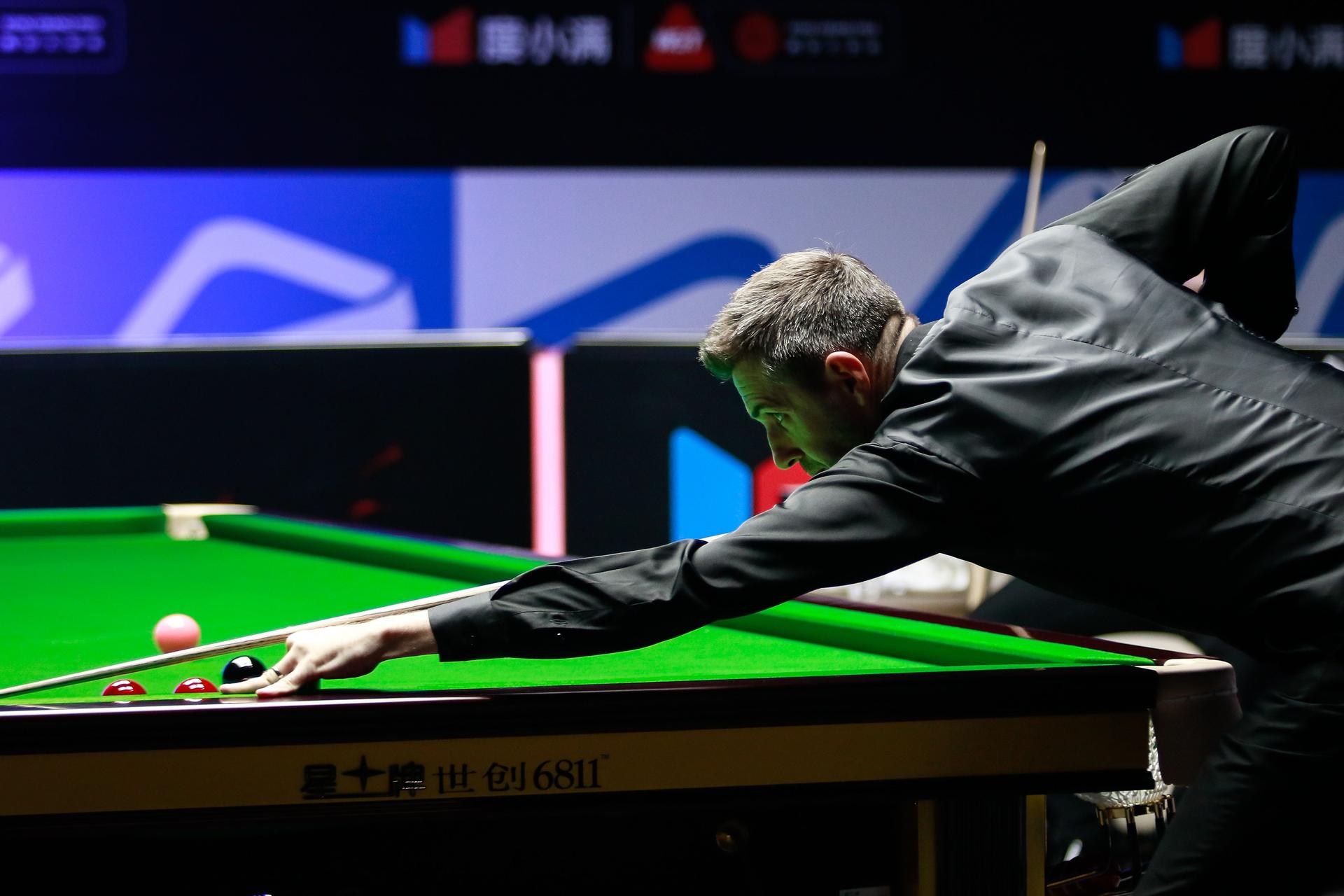 Mark Selby of England plays a shot in the second round 