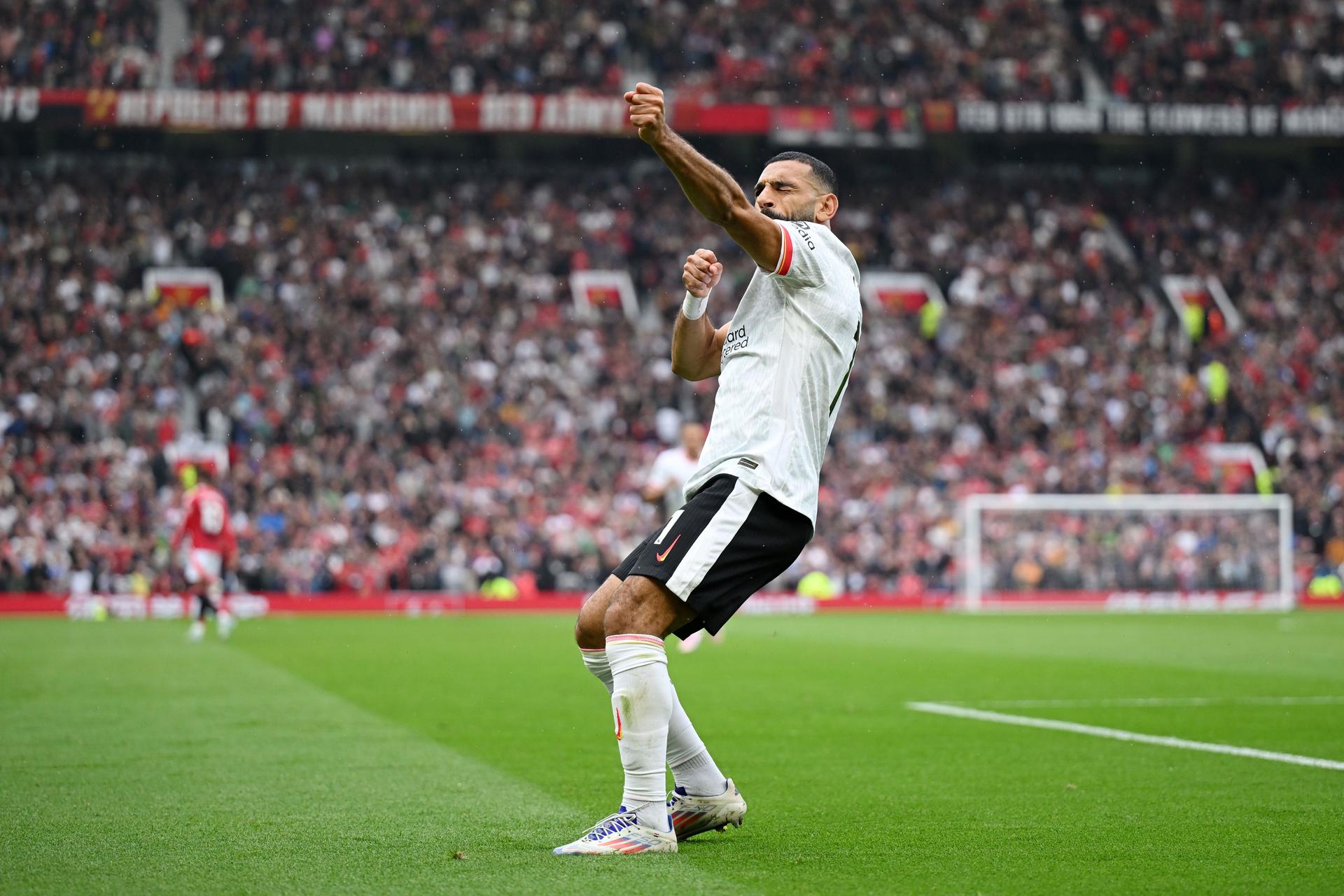 Mohamed Salah of Liverpool celebrates scoring his team's third goal 