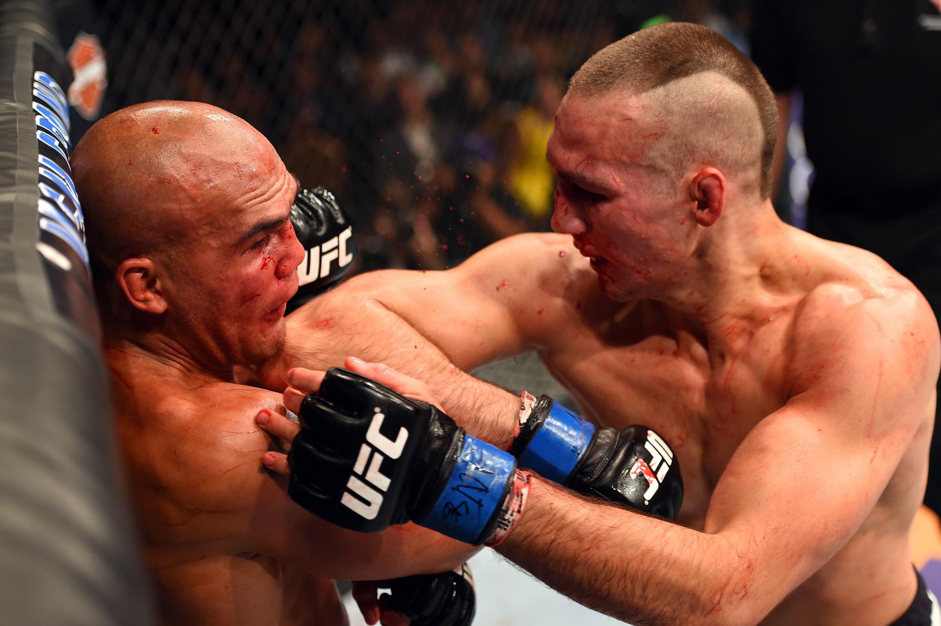 Rory MacDonald elbows Robbie Lawler in 