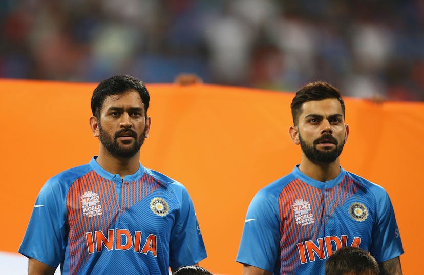  MS Dhoni, Captain of India and Virat Kohli of India looks on during the ICC World Twenty20 India 2016 Semi Final match between West Indies and India at Wankhede Stadium on March 31, 2016 in Mumbai, India