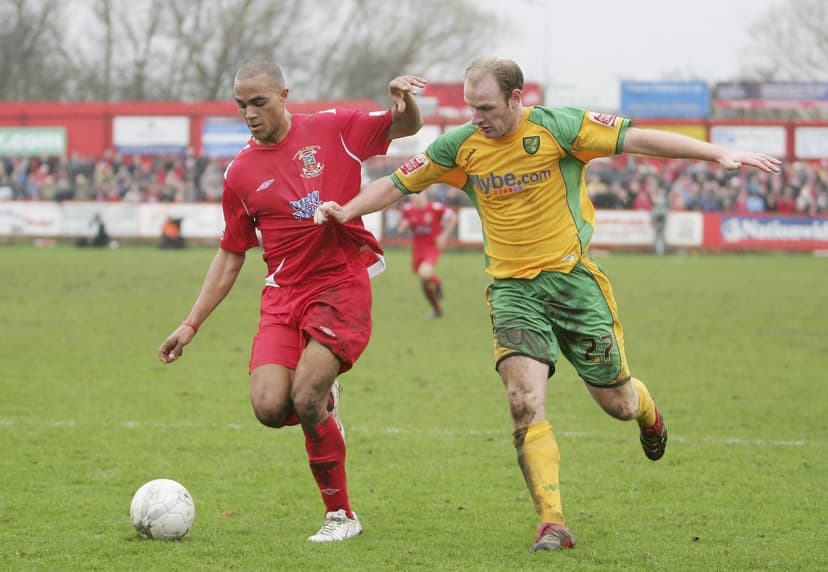  Gary Doherty of Norwich battles with Taiwo Atieno of Tamworth 