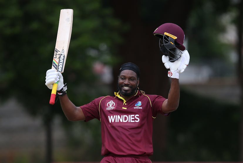 Chris Gayle of The West Indies acknowledges his century during The ICC Cricket World Cup Qualifier 