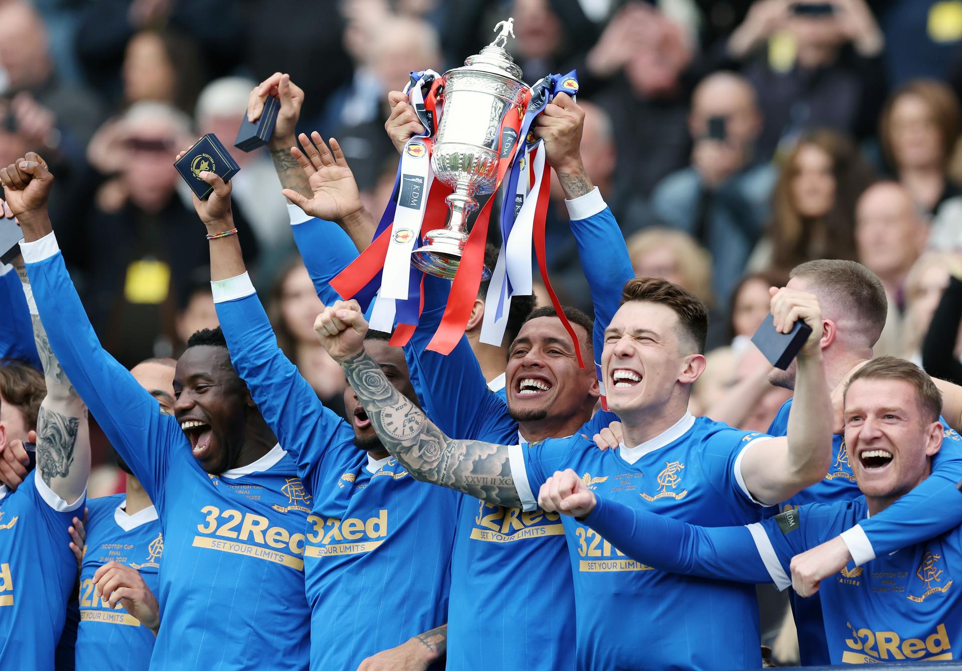 James Tavernier holds the trophy