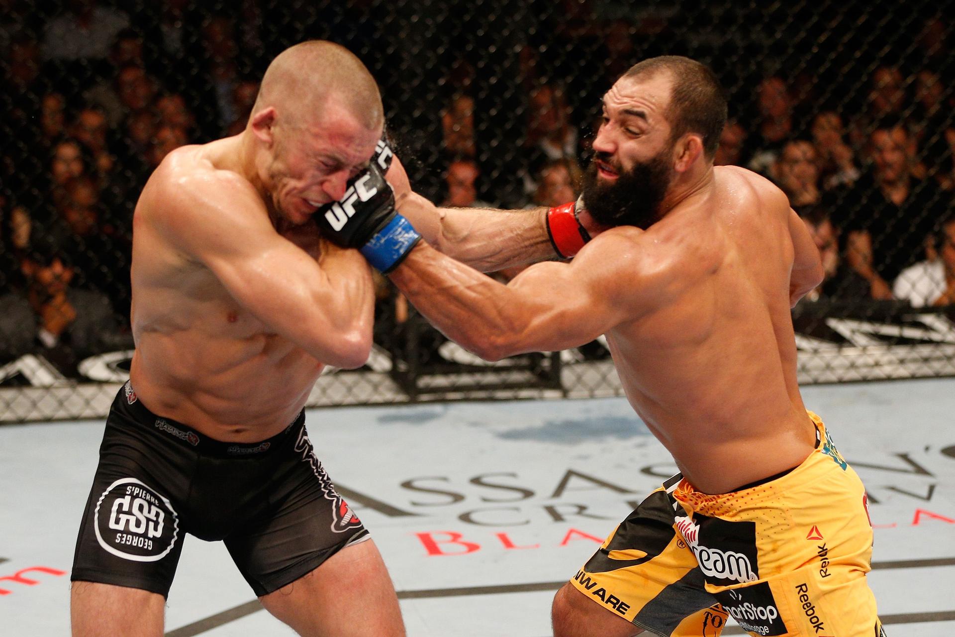 Johny Hendricks punches Georges St-Pierre.jpg