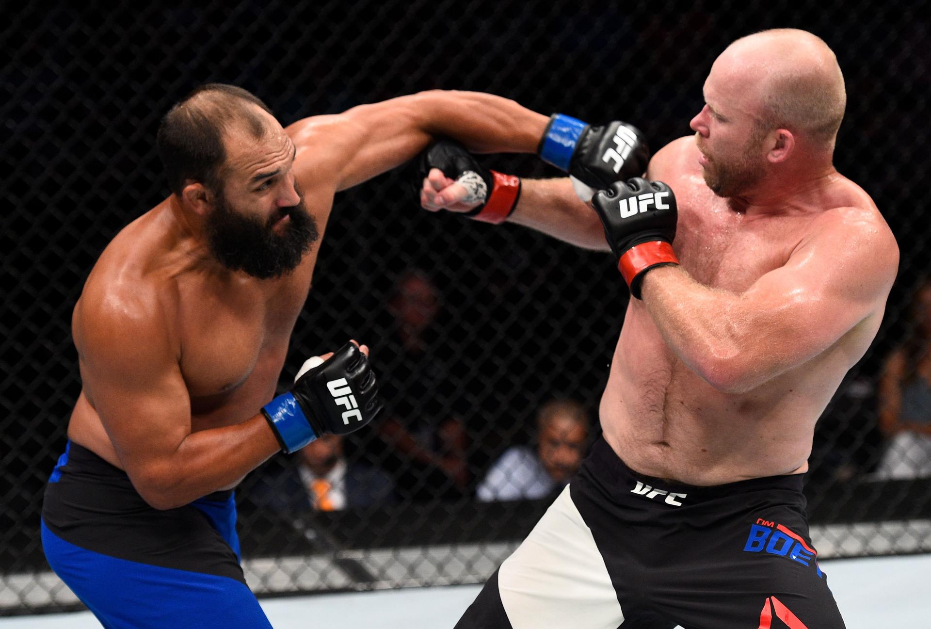 Johny Hendricks punches Tim Boetsch in their middleweight bout during the UFC Fight Night event