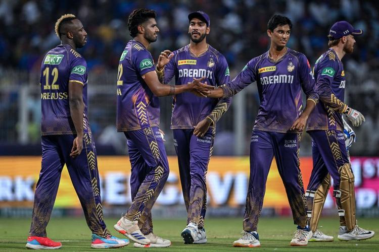 Kolkata Knight Riders' Harshit Rana celebrates with teammates after taking the wicket of Royal Challengers Bengaluru's Virat Kohli in a cricket match