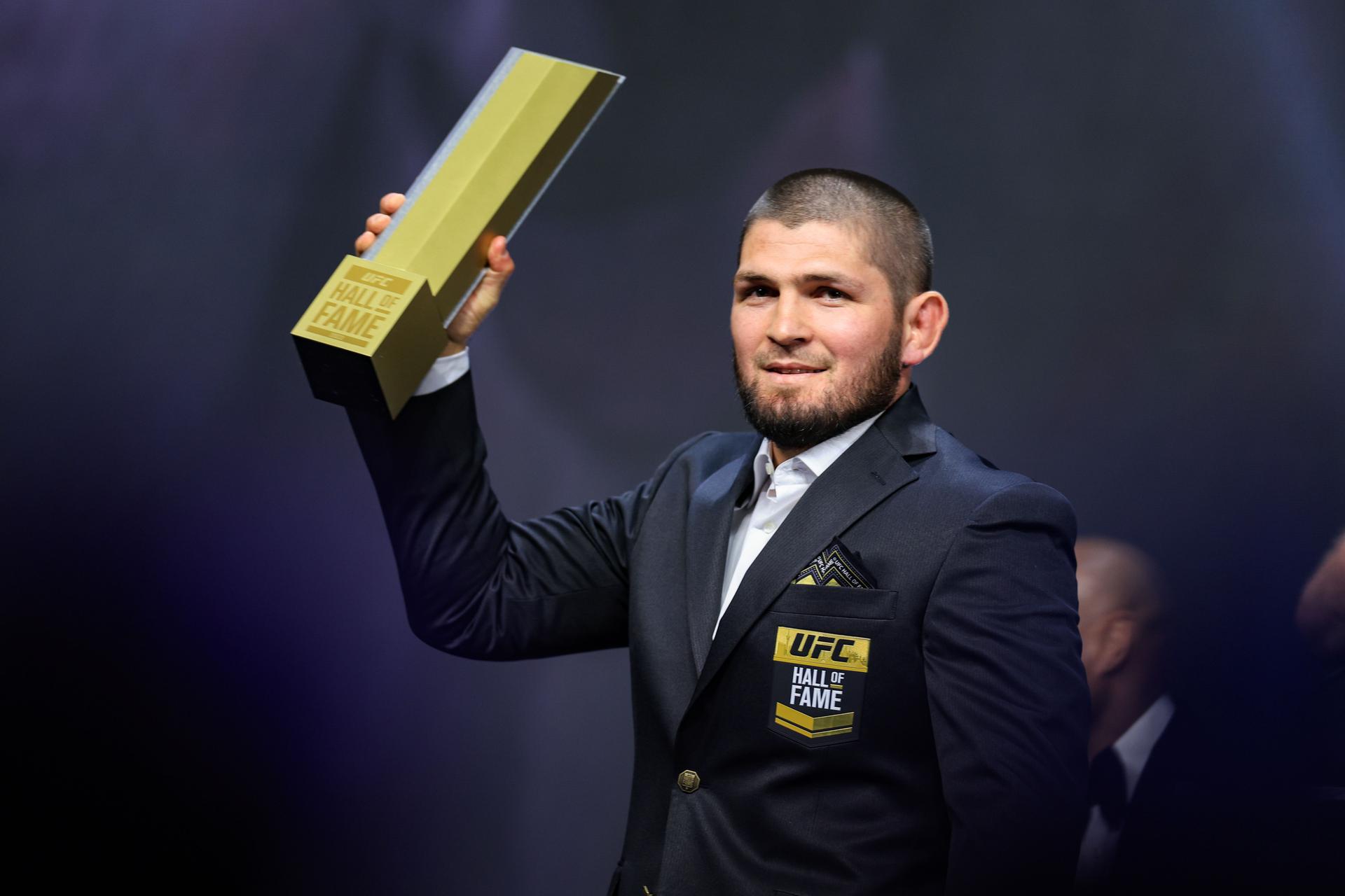 Khabib Nurmagomedov receives his jacket and trophy