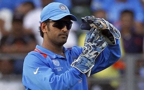 MS Dhoni with DRS Sign.jpeg