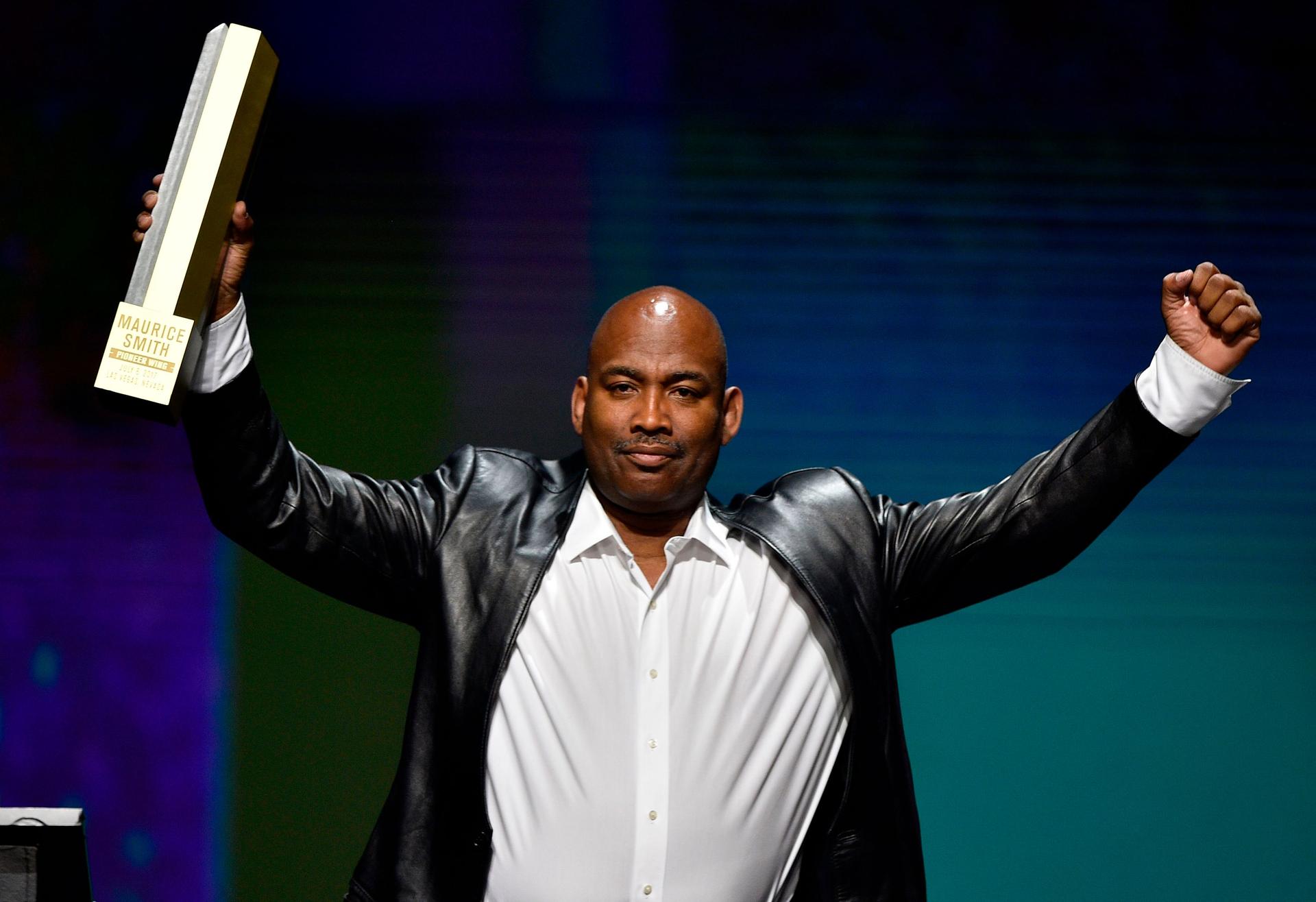 Maurice Smith gestures to the crowd after receiving his UFC Hall of Fame trophy