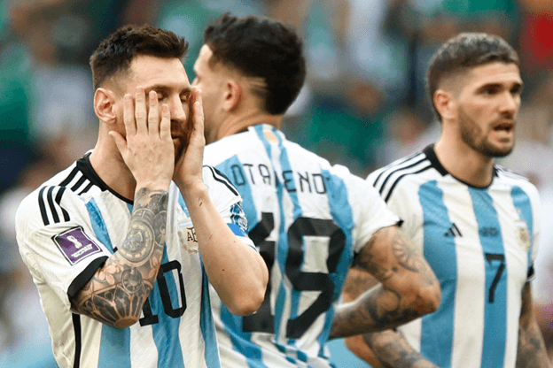 Messi with hand on face 