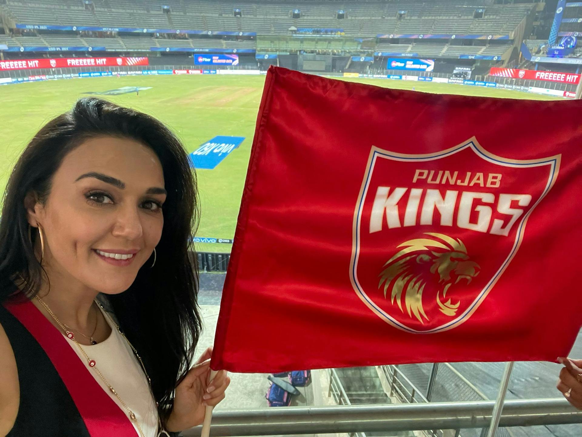 Punjab Kings IPL Priety Zinta with flag.jpeg