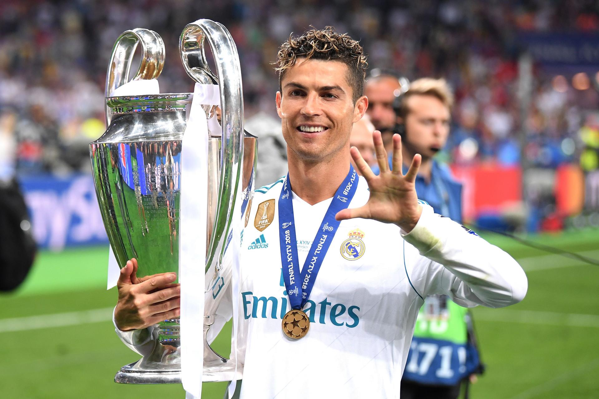 Cristiano Ronaldo of Real Madrid lifts The UEFA Champions League trophy 