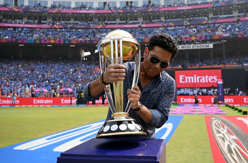 Sachin Tendulkar carries the ICC Men's Cricket World Cup Trophy ahead of the ICC Men's Cricket World Cup India 2023 Final