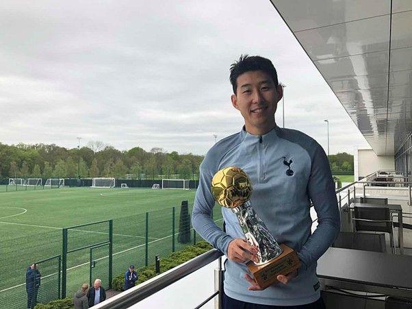 Son Heung-min with his 2018 Best Footballer in Asia Award 