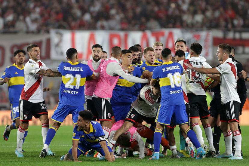 Players of River Plate and players of Boca Juniors scuffle durin