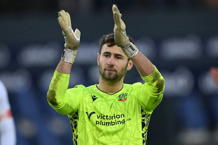 Bolton Wanderers' English goalkeeper Nathan Baxter applauds fans on the pitch after the English FA Cup third-round match 