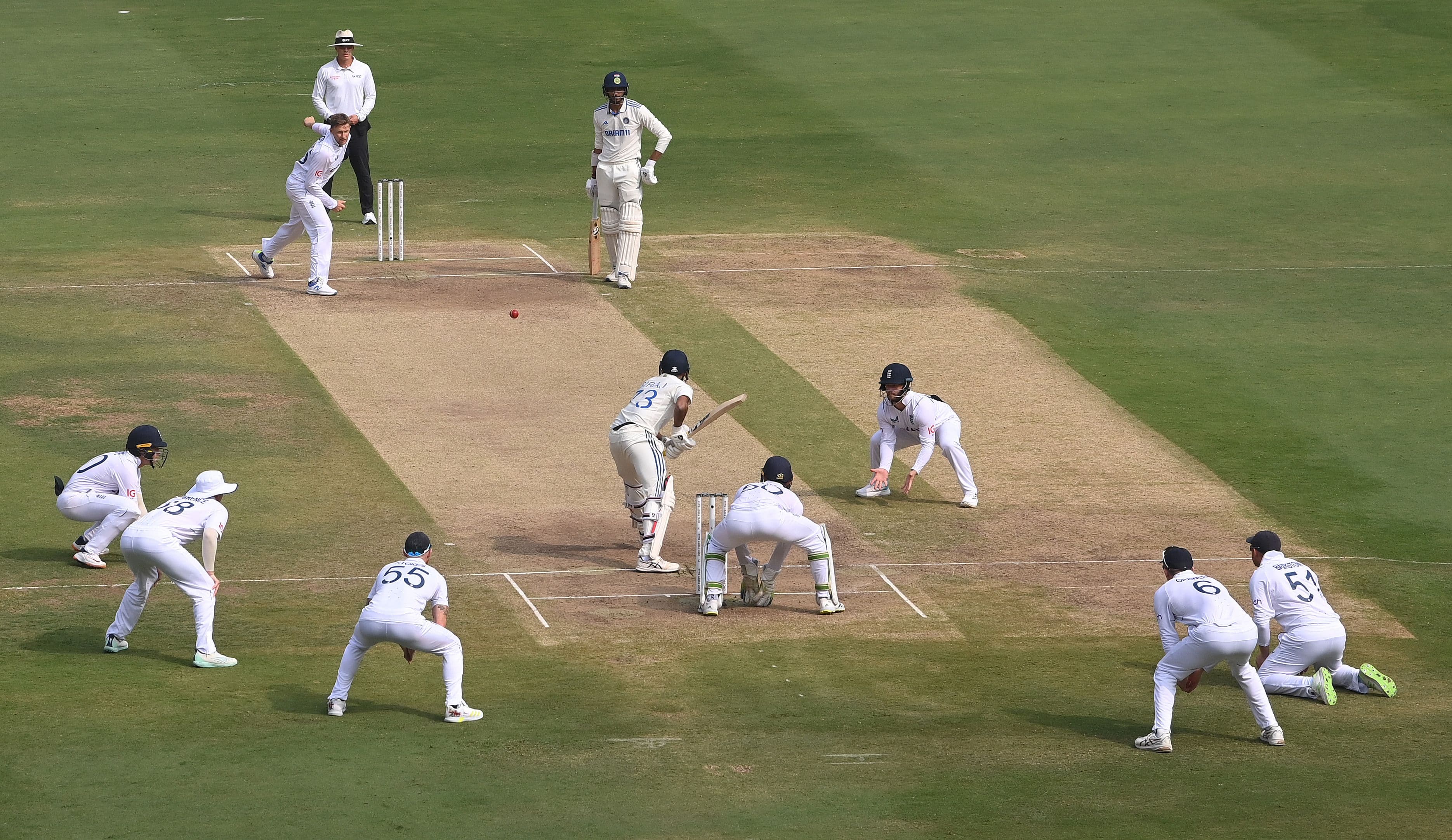 England bowler Joe Root bowls to batsman Mohammed Siraj