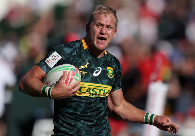  Philip Snyman of South Africa runs with the ball during the match between during Day Two of the Emirates Airline Dubai Sevens