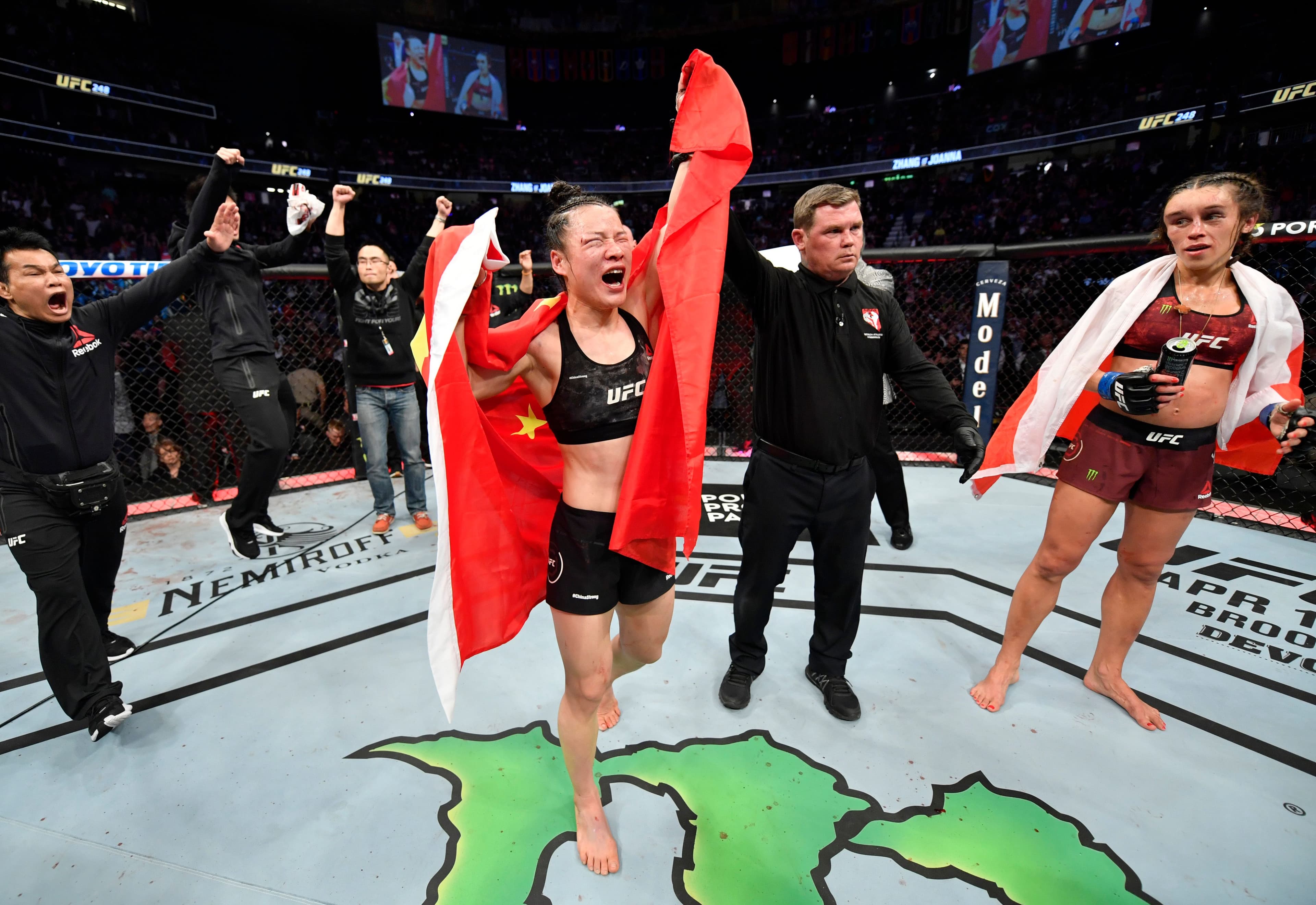 Zhang Weili of China celebrates after her split-decision victory over Joanna Jedrzejczyk 