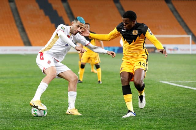 Wydad's Aymane El Hassounin (L) fights for the ball with Chiefs' Willard Katsande (R) during the CAF Champions League 