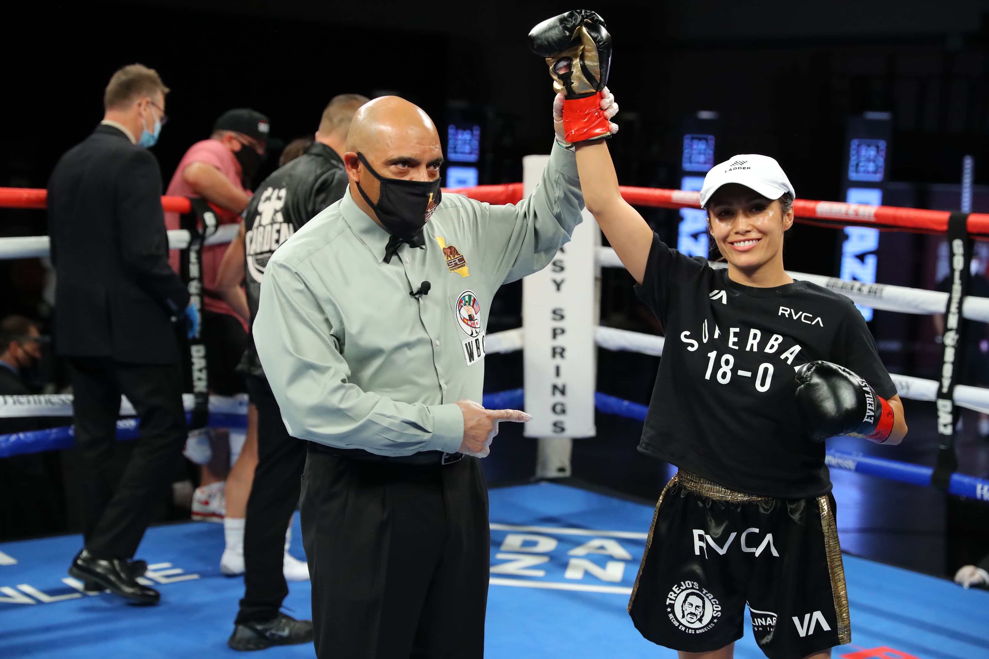 Seniesa Estrada (R) celebrates her knock-out victory over Miranda Adkins 