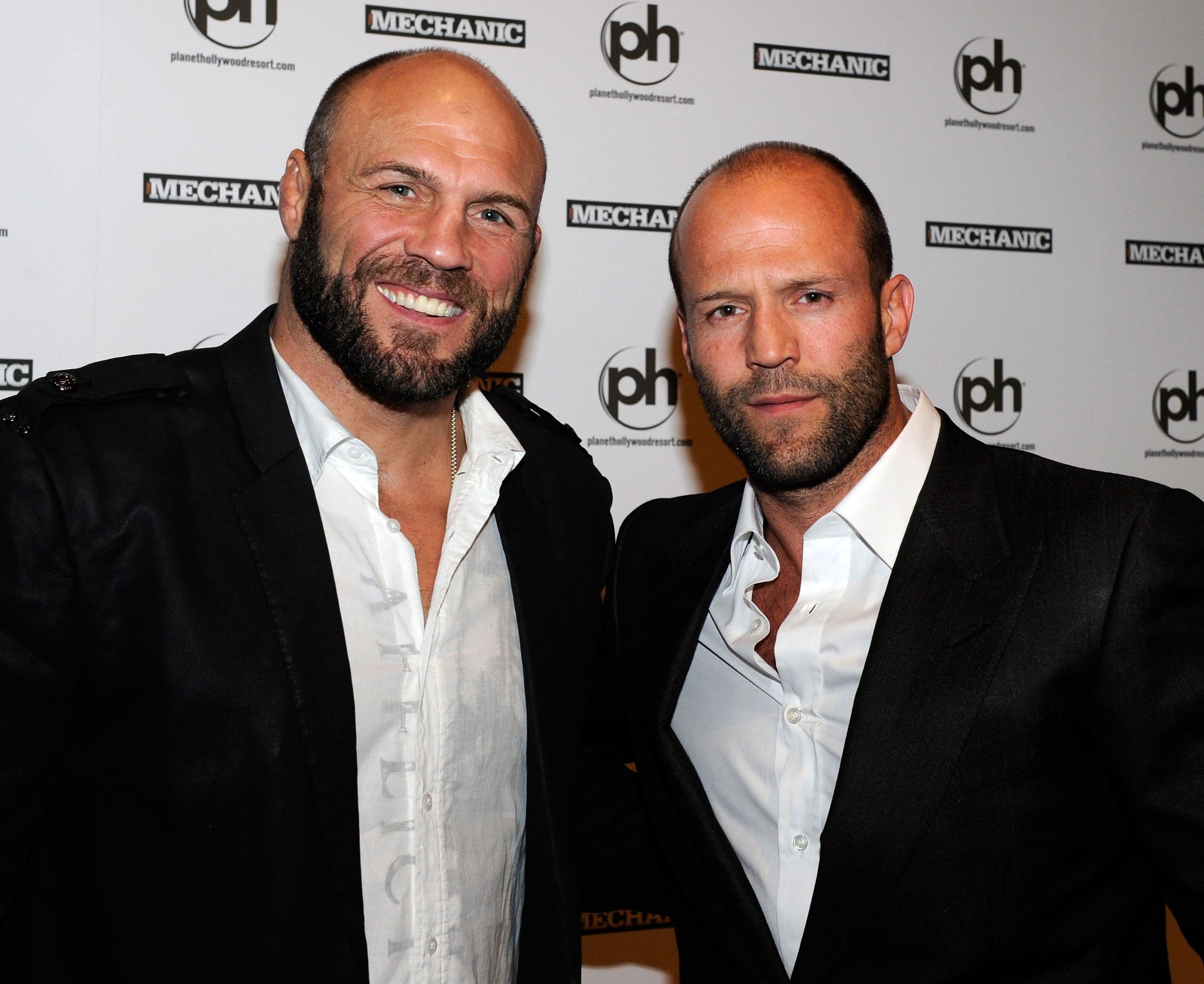 Mixed martial artist and actor Randy Couture (L) and actor Jason Statham 