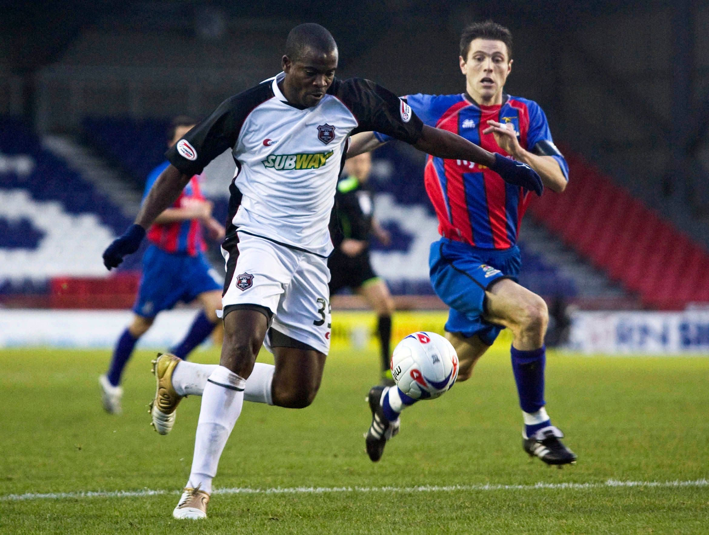 Henry Makinwa gets to the ball