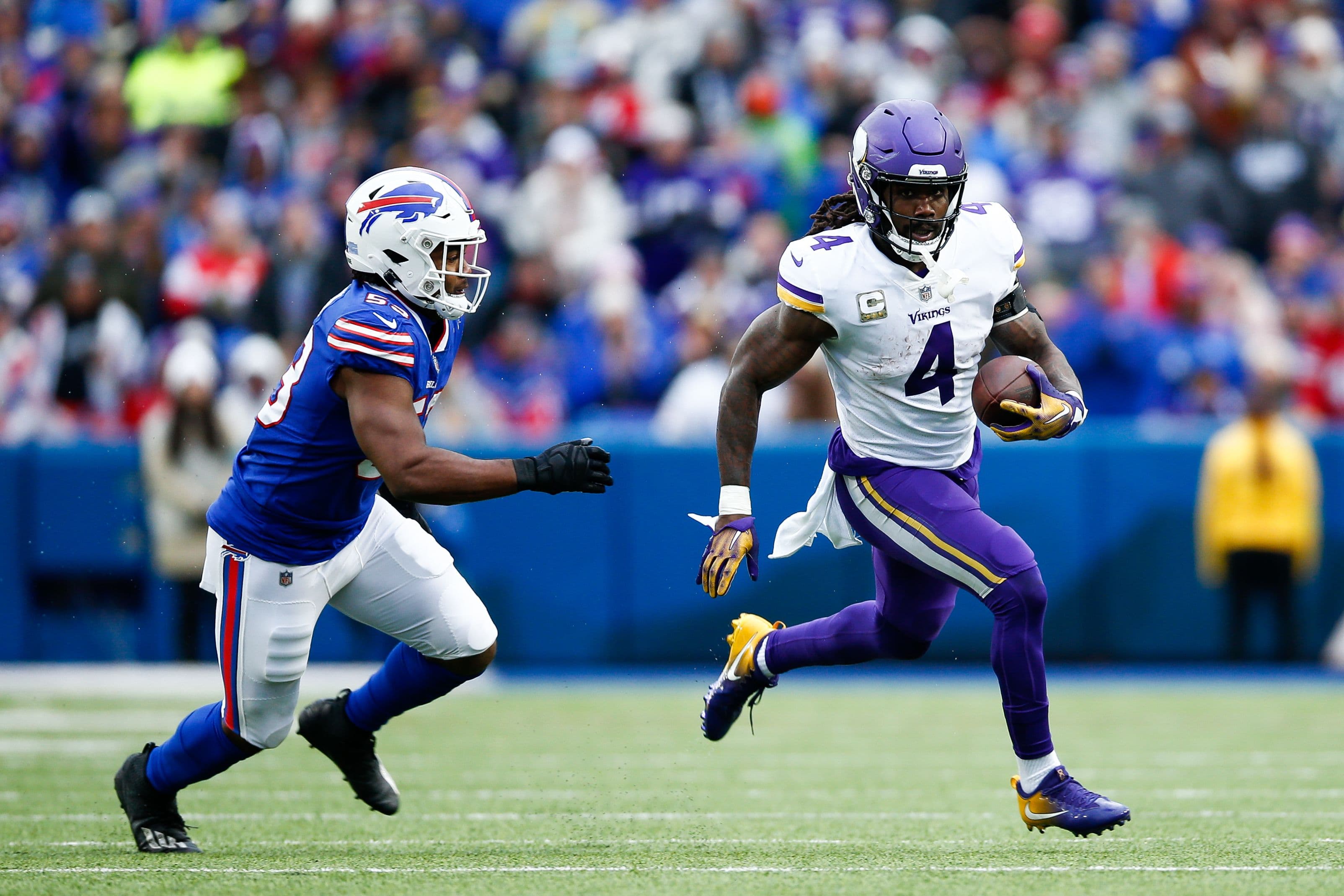 Dalvin Cook #4 of the Minnesota Vikings runs the ball against Tyrel Dodson