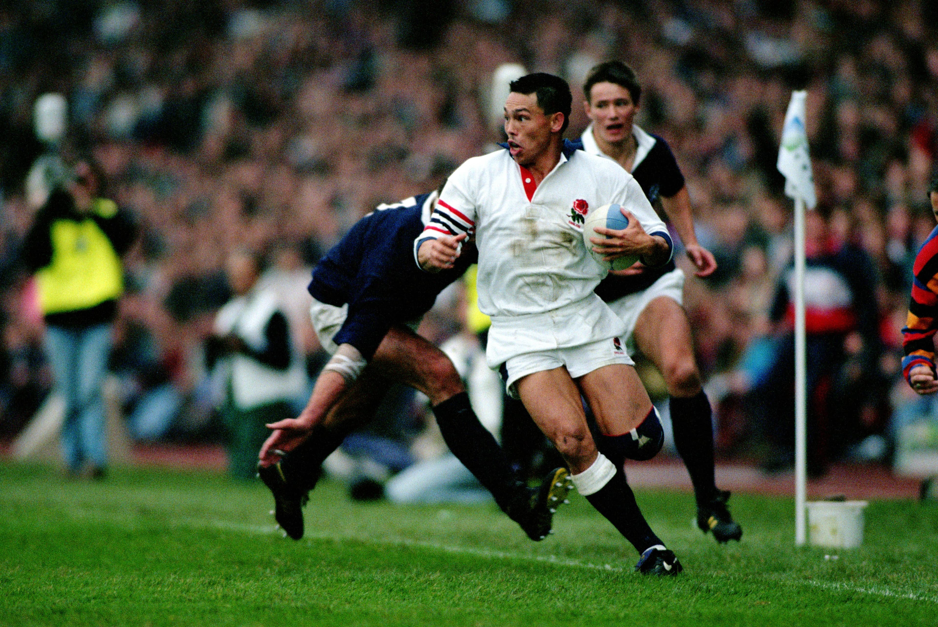 English winger Rory Underwood makes a break