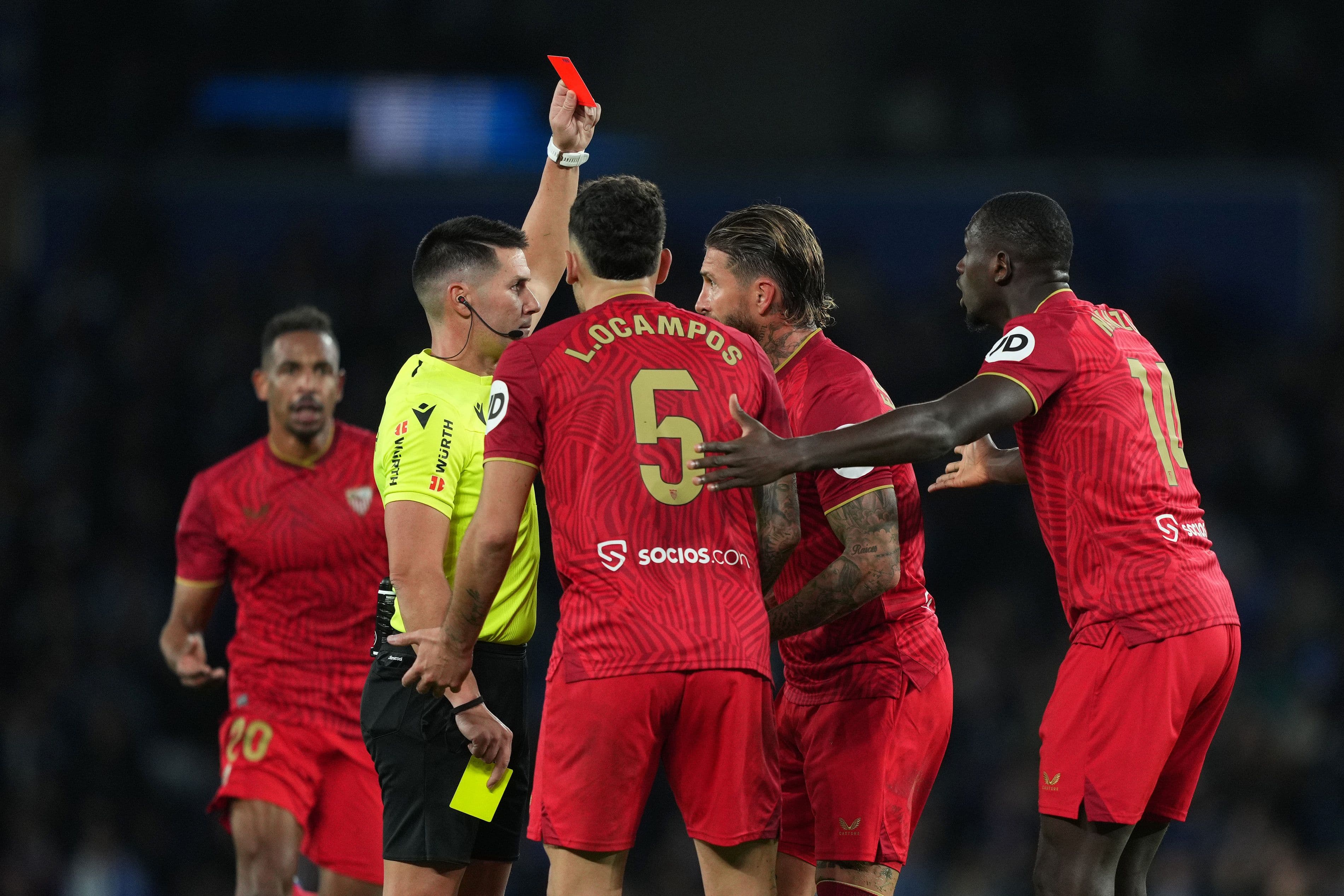 Referee Ortiz Arias shows a red card to Sergio Ramos 