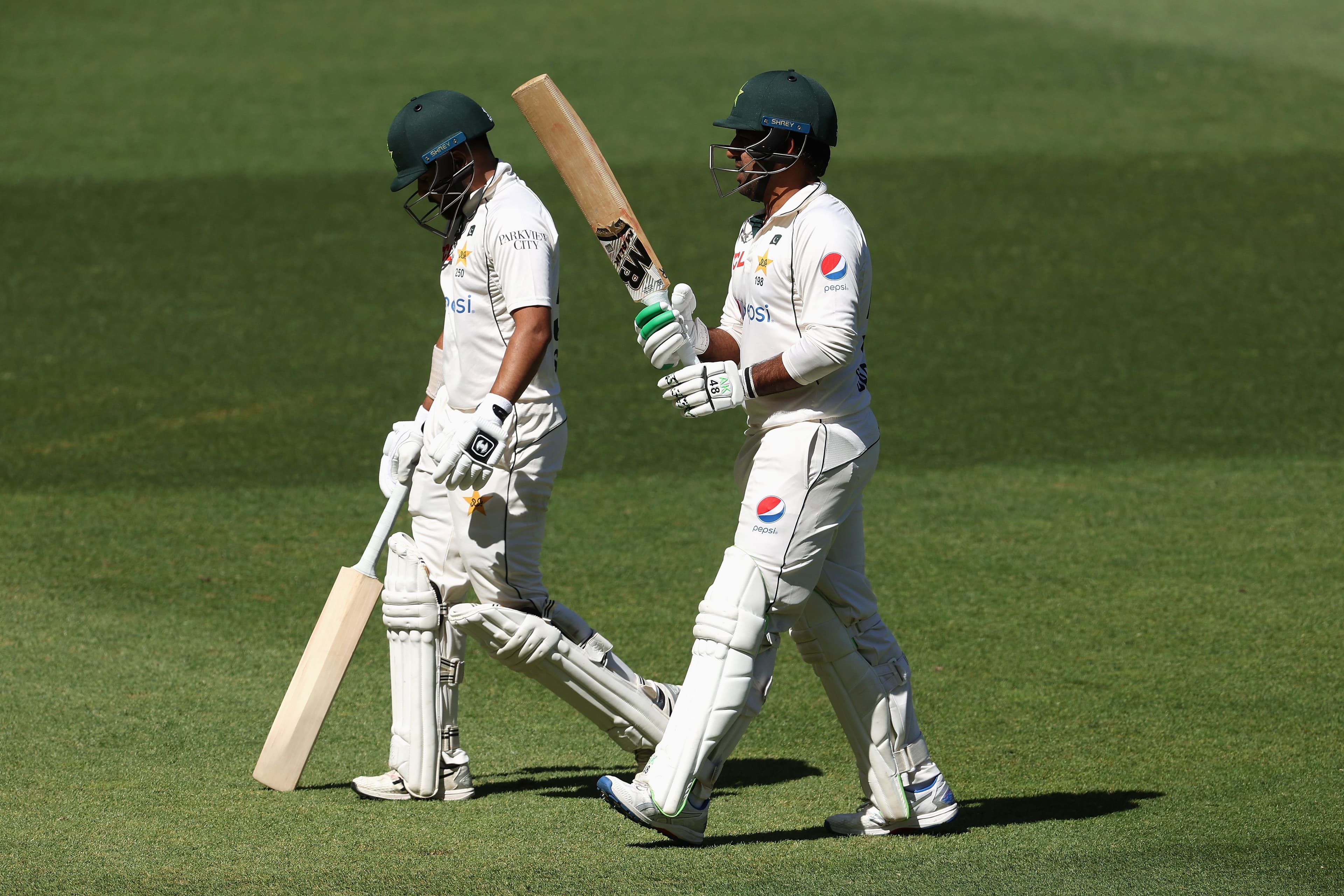 Sarfaraz Ahmed of Pakistan and Saud Shakeel of Pakistan leave the field for the tea break