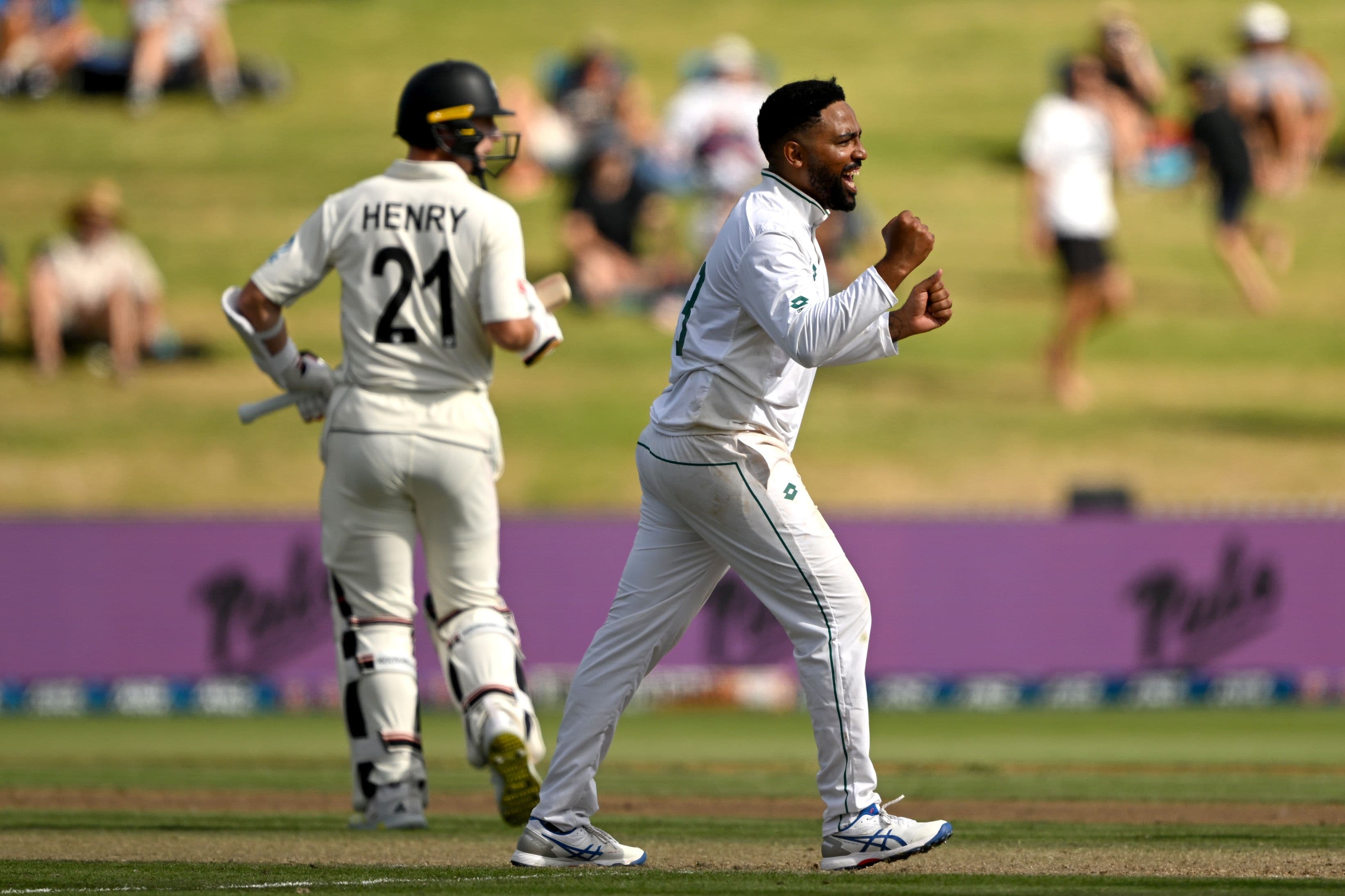 Dane Piedt of South Africa celebrates the wicket of Will Young 