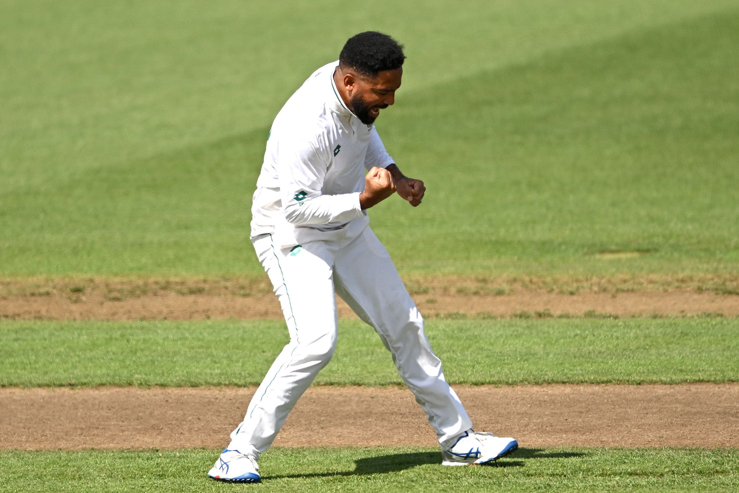 Dane Piedt of South Africa celebrates the wicket