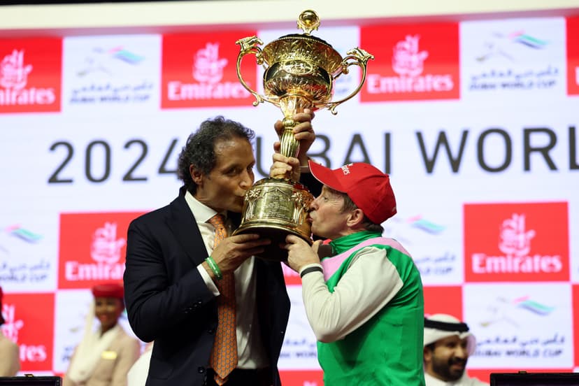 Prize presentation for the Dubai World Cup 2024, as jockey Tadgh O'Shea lifts the trophy with winning trainer, Bhupat Seemar