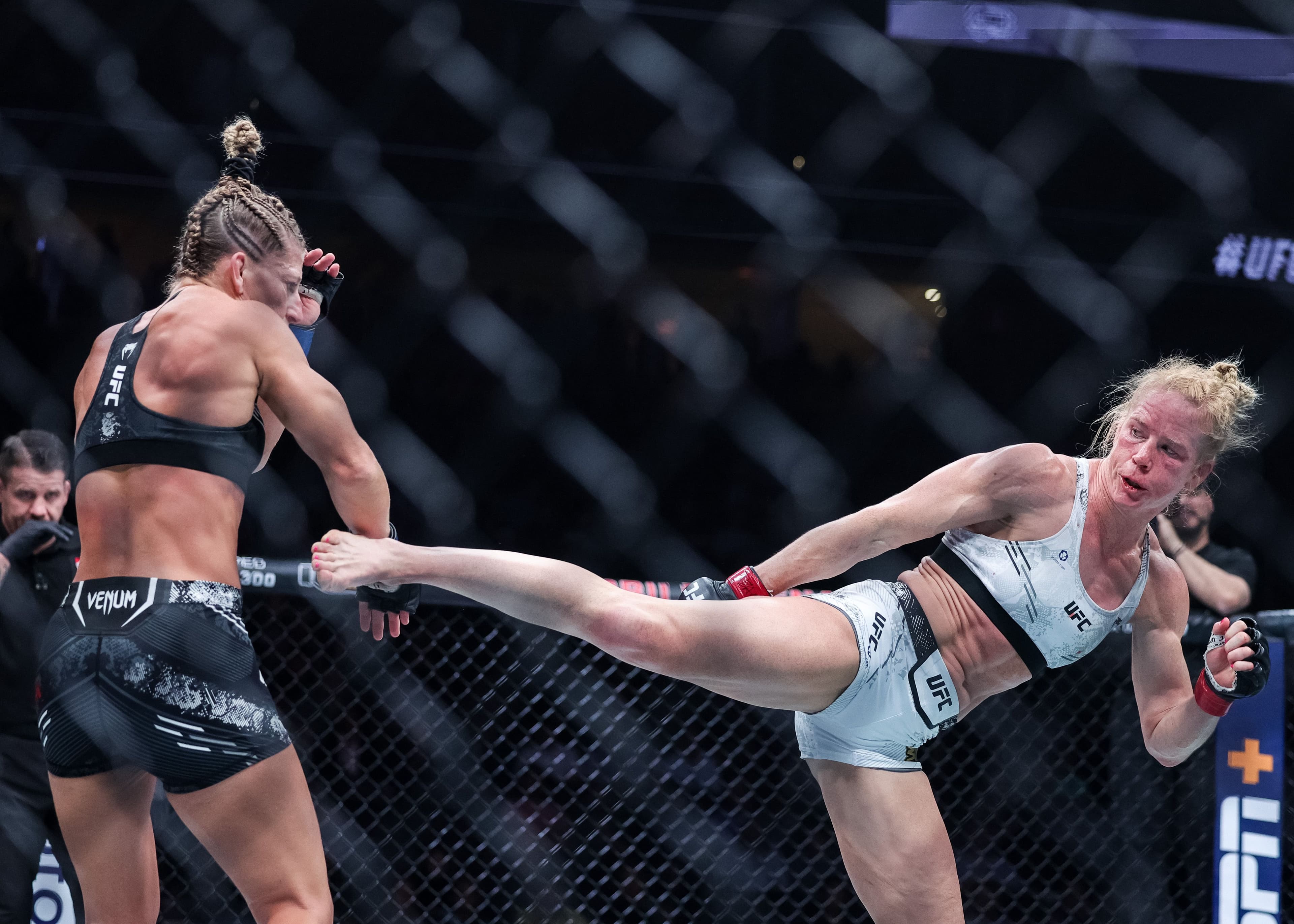 Holly Holm and Kayla Harrison exchange strike during their bantamweight fight 