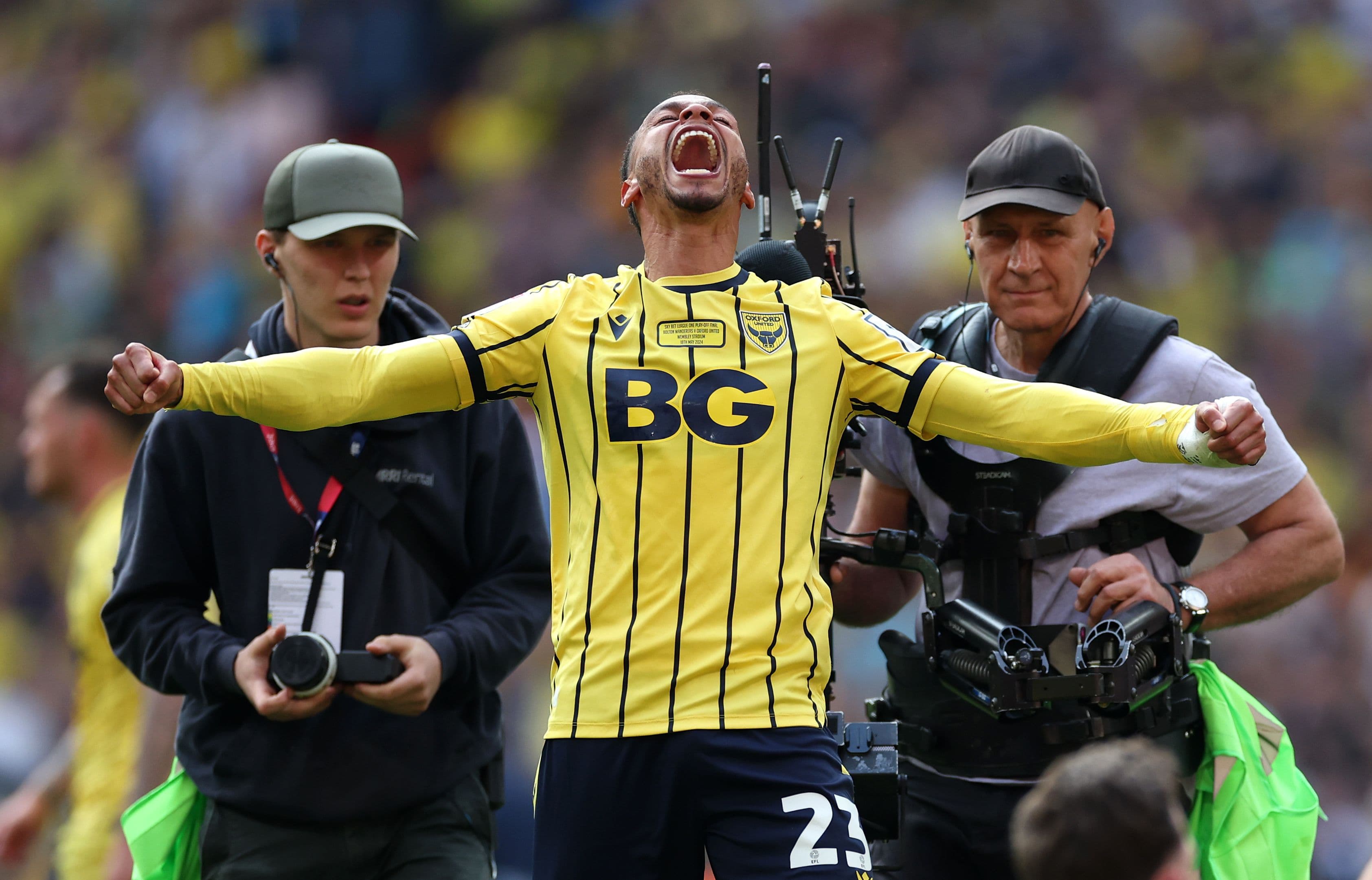 Josh Murphy of Oxford United celebrates promotion to the Sky Bet Championship after the team's victory in the Sky Bet League One Play