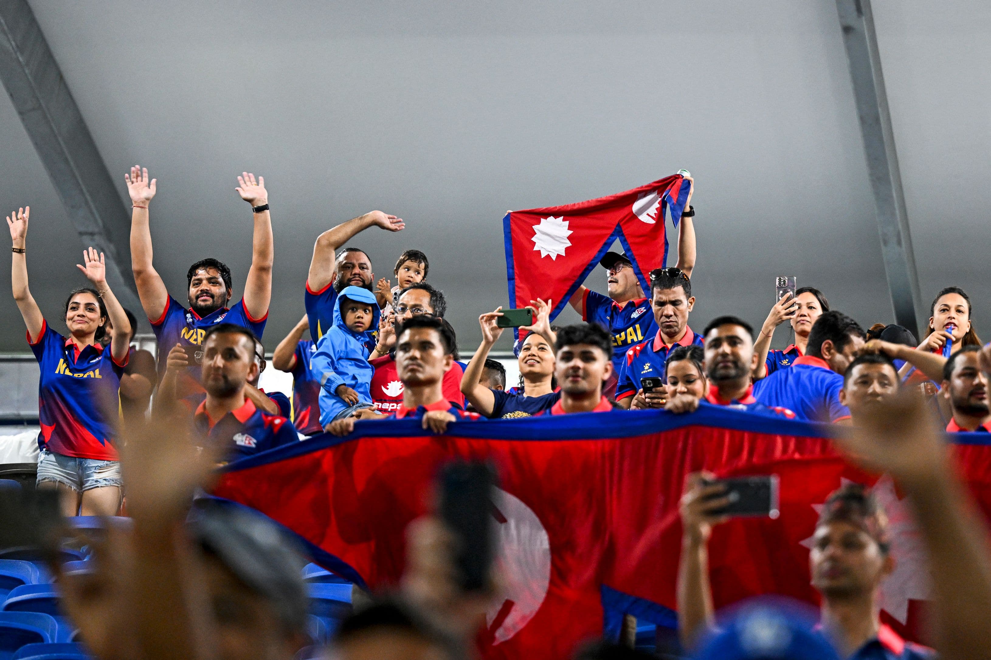 Nepal's supporters cheer for their team after the match was abandoned due to weather conditions during the ICC men's Twenty20 World Cup 2024 group D