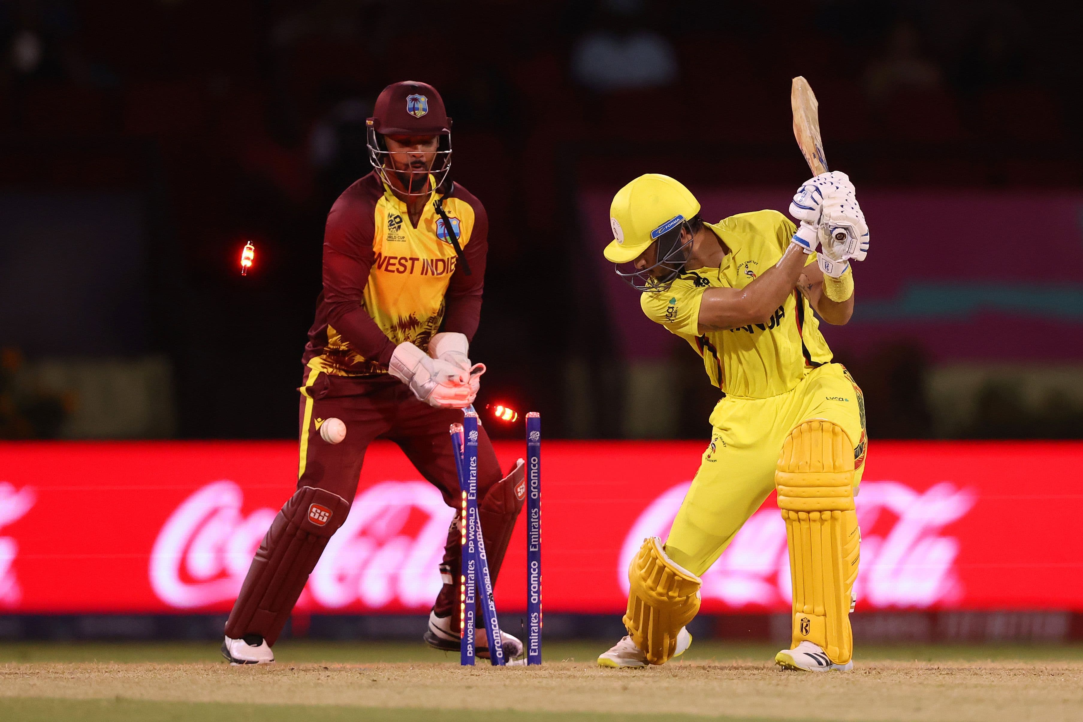 Riazat Ali Shah of Uganda is bowled out by Akeal Hosein of West Indies (not pictured) during the ICC Men's T20 Cricket World Cup