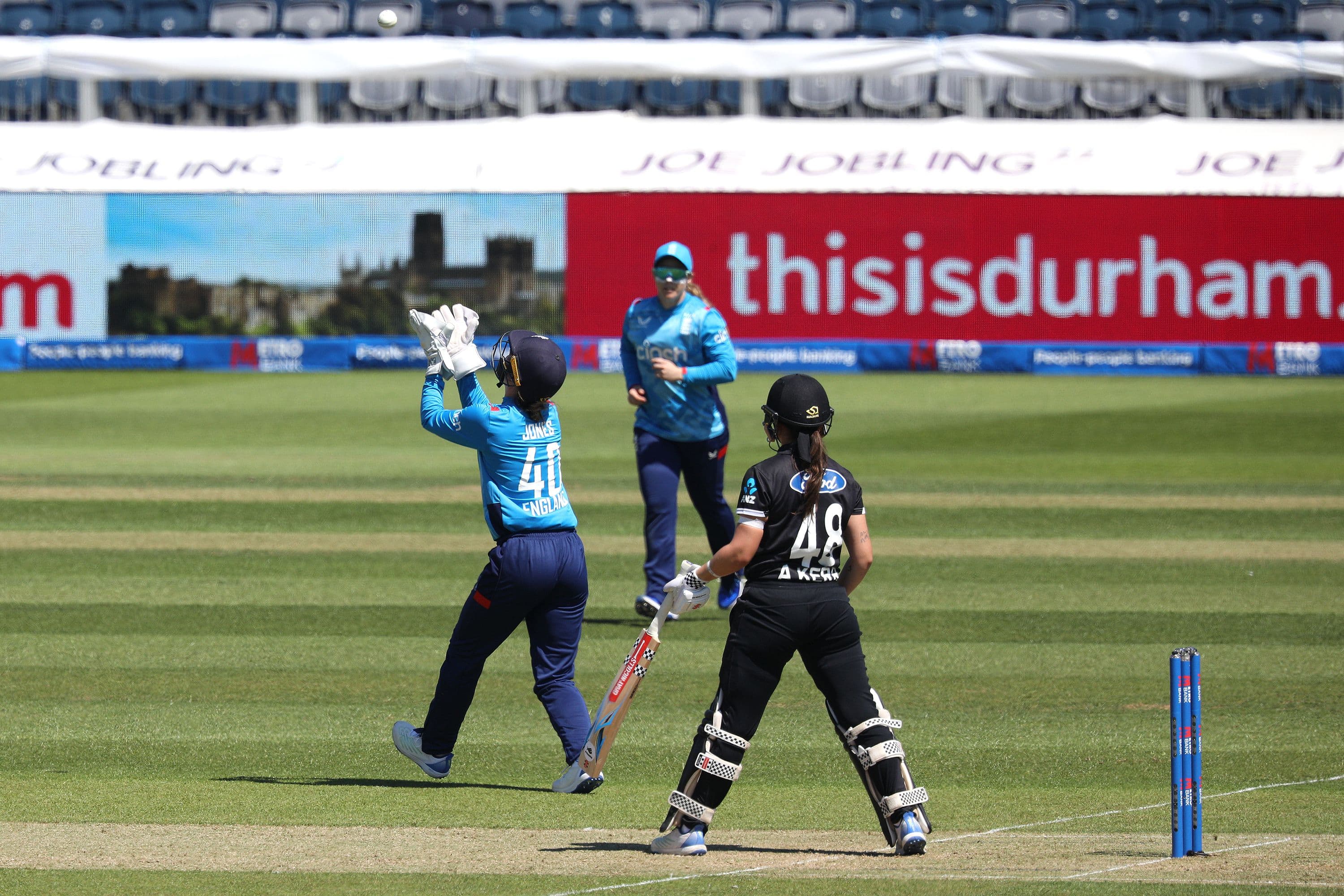 Amy Jones of England is taking a catch to dismiss Amelia Kerr 