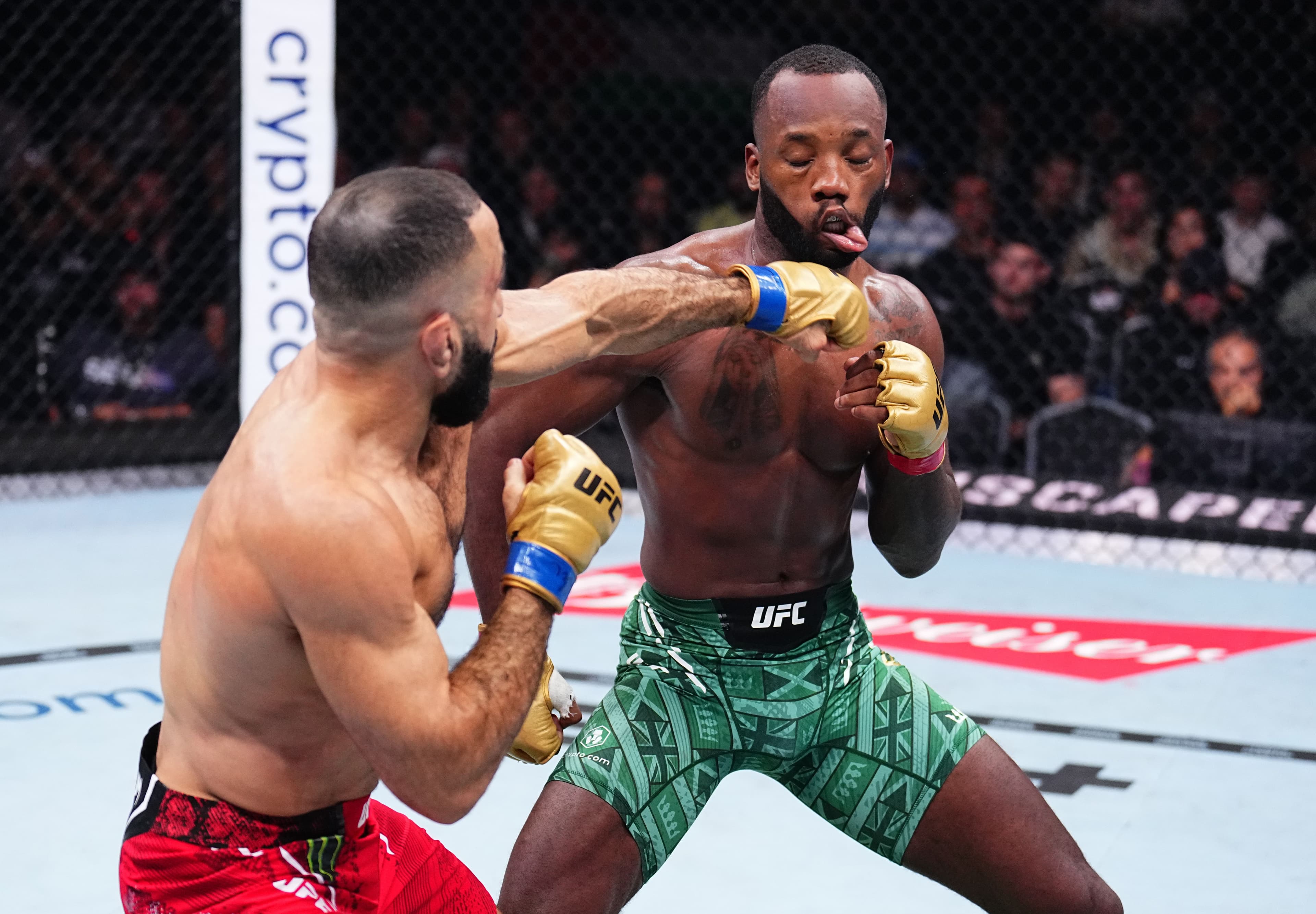 Belal Muhammad punches Leon Edwards of Jamaica 